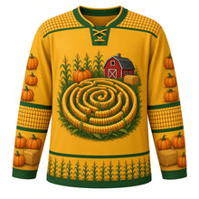 Load image into Gallery viewer, Ugly Thanksgiving Corn Maze Mayhem Hockey Jersey in Harvest Gold, front view – harvest gold body with a corn-cob gold yoke trimmed in field green with a round top-down cornfield maze crest with corn stalks, a lost pumpkin, a red barn and hay bales, corn-cob yoke, kernel and hay-bale sleeve bands and a corn-stalk hem band – custom name and number