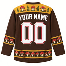 Load image into Gallery viewer, Ugly Thanksgiving Wild Mushroom Forest Hockey Jersey in Bark Brown, back view with a toadstool-and-fern yoke, mushroom and acorn sleeve bands, mushroom-cluster hem band, arched YOUR NAME lettering and 00 – custom name and number