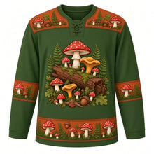 Load image into Gallery viewer, Ugly Thanksgiving Wild Mushroom Forest Hockey Jersey in Moss Green, front view – moss green body with rust orange yoke with a round crest of a mossy fallen log sprouting red spotted toadstools, golden chanterelles and button mushrooms among ferns and oak leaves, toadstool-and-fern yoke, mushroom and acorn sleeve bands and a mushroom-cluster hem band – custom name and number