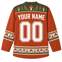 Load image into Gallery viewer, Ugly Thanksgiving Wild Mushroom Forest Hockey Jersey in Rust Orange, back view with a toadstool-and-fern yoke, mushroom and acorn sleeve bands, mushroom-cluster hem band, arched YOUR NAME lettering and 00 – custom name and number