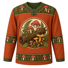 Load image into Gallery viewer, Ugly Thanksgiving Wild Mushroom Forest Hockey Jersey in Rust Orange, front view – rust orange body with moss green yoke with a round crest of a mossy fallen log sprouting red spotted toadstools, golden chanterelles and button mushrooms among ferns and oak leaves, toadstool-and-fern yoke, mushroom and acorn sleeve bands and a mushroom-cluster hem band – custom name and number