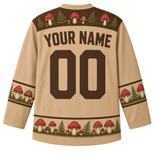 Load image into Gallery viewer, Ugly Thanksgiving Wild Mushroom Forest Hockey Jersey in Toasted Tan, back view with a toadstool-and-fern yoke, mushroom and acorn sleeve bands, mushroom-cluster hem band, arched YOUR NAME lettering and 00 – custom name and number