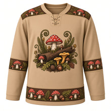 Load image into Gallery viewer, Ugly Thanksgiving Wild Mushroom Forest Hockey Jersey in Toasted Tan, front view – toasted tan body with bark brown yoke with a round crest of a mossy fallen log sprouting red spotted toadstools, golden chanterelles and button mushrooms among ferns and oak leaves, toadstool-and-fern yoke, mushroom and acorn sleeve bands and a mushroom-cluster hem band – custom name and number