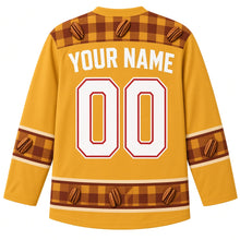 Load image into Gallery viewer, Ugly Thanksgiving Pecan Pie Plaid Hockey Jersey in Butterscotch Gold, back view with a plaid-and-pecan yoke, flannel plaid sleeve bands, pie-slice plaid hem band, arched YOUR NAME lettering and 00 – custom name and number