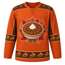 Load image into Gallery viewer, Ugly Thanksgiving Pecan Pie Plaid Hockey Jersey in Burnt Sienna, front view – burnt sienna orange body with brown and gold plaid yoke with a round glossy pecan pie crest with whipped cream, flannel-check plaid yoke, plaid-and-pecan sleeve bands and a pie-slice plaid hem band – custom name and number