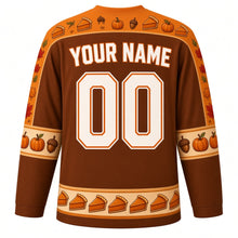 Load image into Gallery viewer, Ugly Thanksgiving Pumpkin Pie Party Hockey Jersey in Cinnamon Brown, back view with a pie-slice and whipped cream yoke, piecrust sleeve bands, pie-slice hem band, arched YOUR NAME lettering and 00 – custom name and number