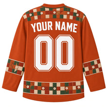 Load image into Gallery viewer, Ugly Thanksgiving Harvest Quilt Patchwork Hockey Jersey in Rust Orange, back view with a patchwork-square and sewn-button yoke, patchwork-and-button sleeve bands, a patchwork quilt-block and button hem band, arched YOUR NAME lettering and 00 – custom name and number