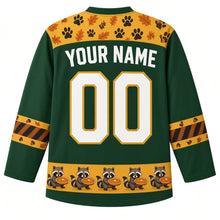 Load image into Gallery viewer, Ugly Thanksgiving Autumn Raccoon Raid Hockey Jersey in Forest Green, back view with a gold paw-print and leaf yoke, raccoon-tail-stripe sleeve bands, a gold raccoon-and-pie hem band, YOUR NAME lettering and 00 – custom name and number