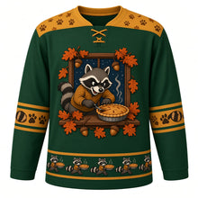 Load image into Gallery viewer, Ugly Thanksgiving Autumn Raccoon Raid Hockey Jersey in Forest Green, front view – masked raccoon in a mustard sweater holding a pie in a wooden window frame with a starry night sky, oak leaves and acorns, gold yoke and a gold raccoon-and-pie hem band – custom name and number