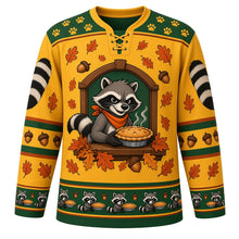 Load image into Gallery viewer, Ugly Thanksgiving Autumn Raccoon Raid Hockey Jersey in Harvest Gold, front view – masked raccoon wearing an orange neckerchief holding a steaming pie in a wooden window frame, oak leaves and acorns on gold, big striped raccoon-tail sleeve art and a raccoon-and-pie hem band – custom name and number