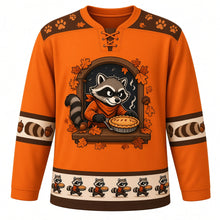 Load image into Gallery viewer, Ugly Thanksgiving Autumn Raccoon Raid Hockey Jersey in Pumpkin Orange, front view – masked cartoon raccoon in an orange sweater holding a lattice pie in a wooden window frame with a starry night sky, oak leaves and acorns, paw-print yoke, raccoon-tail-stripe sleeve bands and a hem of tiny raccoons and pies – custom name and number
