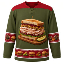Load image into Gallery viewer, Ugly Thanksgiving Leftover Sandwich Stack Hockey Jersey in Olive Green, front view – olive green body with cranberry red yoke with a towering leftover sandwich on a wooden cutting board with sliced roast turkey, stuffing, cranberry sauce and lettuce between toasted bread slices, a wooden toothpick and a pickle wedge, roast turkey, mini-sandwich and pumpkin sleeve bands and a mini-sandwich, corn and pumpkin hem band – custom name and number