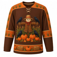 Load image into Gallery viewer, Ugly Thanksgiving Scarecrow Field Hockey Jersey in Chestnut Brown, front view – chestnut brown body with orange yoke with a round patchwork scarecrow crest in a corn and wheat field with crows and pumpkins, corn and wheat yoke, patchwork sleeve bands and a pumpkin and hay bale hem band – custom name and number