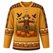 Load image into Gallery viewer, Ugly Thanksgiving Scarecrow Field Hockey Jersey in Wheat Gold, front view – wheat gold body with brown yoke with a round patchwork scarecrow crest in a corn and wheat field with crows and pumpkins, corn and wheat yoke, patchwork sleeve bands and a pumpkin and hay bale hem band – custom name and number