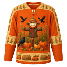Load image into Gallery viewer, Ugly Thanksgiving Scarecrow Field Hockey Jersey in Burnt Orange, front view – burnt orange body with wheat gold yoke with a round patchwork scarecrow crest in a corn and wheat field with crows and pumpkins, corn and wheat yoke, patchwork sleeve bands and a pumpkin and hay bale hem band – custom name and number