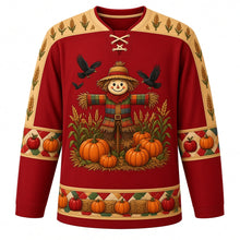 Load image into Gallery viewer, Ugly Thanksgiving Scarecrow Field Hockey Jersey in Barn Red, front view – barn red body with gold yoke with a round patchwork scarecrow crest in a corn and wheat field with crows and pumpkins, corn and wheat yoke, patchwork sleeve bands and a pumpkin and hay bale hem band – custom name and number