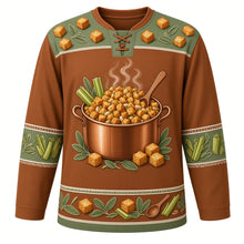 Load image into Gallery viewer, Ugly Thanksgiving Stuffing Stockpot Hockey Jersey in Cinnamon Brown, front view – cinnamon brown body with sage green yoke with a copper stockpot of toasted bread-cube stuffing with celery, onions and sage, rising steam and a wooden spoon, a bread-cube and sage-leaf yoke and celery and sage sleeve bands – custom name and number