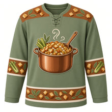 Load image into Gallery viewer, Ugly Thanksgiving Stuffing Stockpot Hockey Jersey in Sage Green, front view – sage green body with cinnamon brown yoke with a copper stockpot of toasted bread-cube stuffing with celery, onions and sage, rising steam and a wooden spoon, a bread-cube and sage-leaf yoke and celery and sage sleeve bands – custom name and number