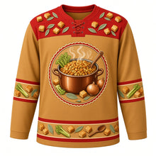 Load image into Gallery viewer, Ugly Thanksgiving Stuffing Stockpot Hockey Jersey in Toasted Gold, front view – toasted gold body with paprika red yoke with a copper stockpot of toasted bread-cube stuffing with celery, onions and sage, rising steam and a wooden spoon, a bread-cube and sage-leaf yoke and celery and sage sleeve bands – custom name and number