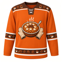 Load image into Gallery viewer, Ugly Thanksgiving Sweet Potato Casserole Hockey Jersey in Sweet Potato Orange, front view – sweet potato orange body with pecan brown yoke with a round crest of a steaming sweet potato casserole topped with toasted marshmallows and pecans, framed by oven mitts and a serving spoon, marshmallow-and-pecan yoke, sweet potato sleeve bands and a mini casserole hem band – custom name and number