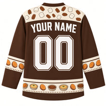 Load image into Gallery viewer, Ugly Thanksgiving Sweet Potato Casserole Hockey Jersey in Pecan Brown, back view with a marshmallow-and-pecan yoke, sweet potato slice sleeve bands, mini casserole hem band, arched YOUR NAME lettering and 00 – custom name and number