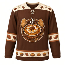 Load image into Gallery viewer, Ugly Thanksgiving Sweet Potato Casserole Hockey Jersey in Pecan Brown, front view – pecan brown body with marshmallow cream yoke with a round crest of a steaming sweet potato casserole topped with toasted marshmallows and pecans, framed by oven mitts and a serving spoon, marshmallow-and-pecan yoke, sweet potato sleeve bands and a mini casserole hem band – custom name and number