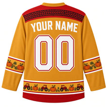 Load image into Gallery viewer, Ugly Thanksgiving Pumpkin Patch Tractor Hockey Jersey in Hay Gold, back view with a black tire-track yoke, red-trimmed gold pumpkin-vine sleeve bands, a red-trimmed gold tiny tractor and pumpkin hem band, arched YOUR NAME lettering and 00 – custom name and number