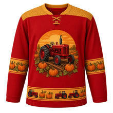 Load image into Gallery viewer, Ugly Thanksgiving Pumpkin Patch Tractor Hockey Jersey in Tractor Red, front view – tractor red body with hay gold yoke with a round-topped crest of an unbranded vintage red farm tractor with big rear tires and a tall exhaust stack driving down a dirt row through a pumpkin patch with curly vines under a low orange sun, a tire-tread chevron yoke, gold pumpkin-vine sleeve bands and a gold tiny tractor and pumpkin hem band – custom name and number