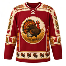 Load image into Gallery viewer, Ugly Thanksgiving Strutting Turkey Hockey Jersey in Cranberry Red, front view – cranberry red body with cream yoke with a round cartoon strutting turkey crest with a fanned autumn tail on a wheat field, feather-and-acorn yoke, feather and corn sleeve bands and a strutting-turkey hem band – custom name and number
