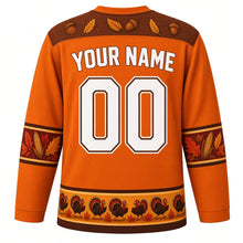 Load image into Gallery viewer, Ugly Thanksgiving Strutting Turkey Hockey Jersey in Harvest Orange, back view with a feather-and-acorn yoke, feather and corn sleeve bands, strutting-turkey hem band, arched YOUR NAME lettering and 00 – custom name and number