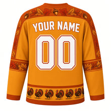 Load image into Gallery viewer, Ugly Thanksgiving Strutting Turkey Hockey Jersey in Golden Wheat, back view with a feather-and-acorn yoke, feather and corn sleeve bands, strutting-turkey hem band, arched YOUR NAME lettering and 00 – custom name and number