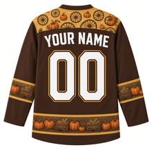 Load image into Gallery viewer, Ugly Thanksgiving Pumpkin Wagon Haul Hockey Jersey in Walnut Brown, back view with a wagon-wheel and pumpkin yoke, wooden-plank bands with pumpkins on the sleeves and hem, arched YOUR NAME lettering and 00 – custom name and number