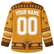 Load image into Gallery viewer, Ugly Thanksgiving Golden Wheat Sheaf Hockey Jersey in Golden Wheat, back view with a wheat-ear yoke, braided-wheat and bread-loaf sleeve bands, tied wheat-bundle hem band, arched YOUR NAME lettering and 00 – custom name and number
