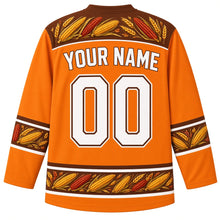 Load image into Gallery viewer, Ugly Thanksgiving Calico Corn Wreath Hockey Jersey in Pumpkin Orange, back view with a yoke of calico corn ears and wheat, corn-and-wheat sleeve bands and hem band, arched YOUR NAME lettering and 00 – custom name and number