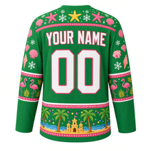 Load image into Gallery viewer, Ugly Christmas Tropical Beach Christmas Hockey Jersey in Palm Green, back view with a starfish and seashell yoke, flamingo sleeve bands, a beach hem band of palm trees, string lights, waves and sandcastles, arched YOUR NAME lettering and 00 – custom name and number