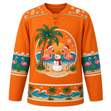 Load image into Gallery viewer, Ugly Christmas Tropical Beach Christmas Hockey Jersey in Sunset Orange, front view – sunset orange body with a light-strung palm tree at sunset, two flamingos in red festive hats and a snowman with a starfish on his head and a red scarf, flamingo sleeve bands and a palm-tree-and-wave hem band – custom name and number