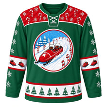 Load image into Gallery viewer, Ugly Christmas Bobsled Snow Run Hockey Jersey in Pine Green, front view – round crest of a red two-person bobsled with a white star on its nose racing down a snowy track lined with candy canes and pine trees on a pine green body, red candy-cane and snowflake yoke, bobsled elbow bands and a green pine tree hem band – custom name and number