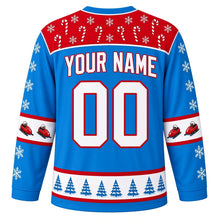 Load image into Gallery viewer, Ugly Christmas Bobsled Snow Run Hockey Jersey in Ice Blue, back view with a red candy-cane and snowflake yoke, snowflake sleeves with bobsled elbow bands, a pine tree hem band and white YOUR NAME and 00 trimmed in red – your name and number