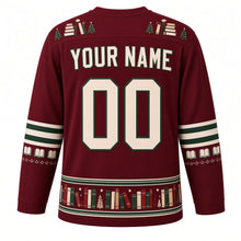 Load image into Gallery viewer, Ugly Christmas Cozy Bookshop Noel Hockey Jersey in Bookshop Burgundy, back view with a stacked-book and tiny-tree yoke, green-striped open-book sleeve bands, a book-spine hem band with trees and stars, cream YOUR NAME and 00 – your name and number