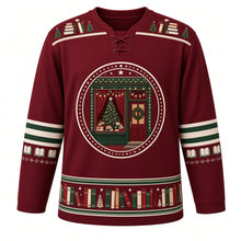 Load image into Gallery viewer, Ugly Christmas Cozy Bookshop Noel Hockey Jersey in Bookshop Burgundy, front view – round starry crest of a cozy bookshop window with a lit Christmas tree, stacked books, string lights and a wreathed red door, stacked-book and tiny-tree yoke, cream and green striped elbow bands with open books and a hem band of colorful book spines with tiny trees and stars – custom name and number