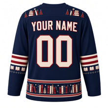 Load image into Gallery viewer, Ugly Christmas Cozy Bookshop Noel Hockey Jersey in Ink Navy, back view with a stacked-book and tiny-tree yoke, red-striped open-book sleeve bands, a book-spine hem band, cream YOUR NAME and 00 – your name and number