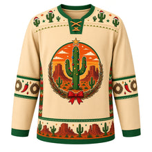Load image into Gallery viewer, Ugly Christmas Desert Cactus Christmas Hockey Jersey in Desert Sand, front view – star-topped saguaro trimmed with ornaments in an orange sunset desert with mesas and baby cacti, twig wreath with a red bow, Santa-hat cactus yoke, chili pepper sleeve bands and a saguaro and red rock hem band – custom name and number