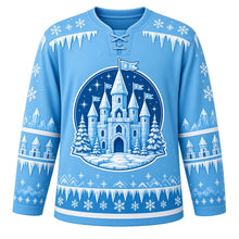 Load image into Gallery viewer, Ugly Christmas Ice Castle Kingdom Hockey Jersey in Glacier Blue, front view – ice-block castle with pointed turrets and snowflake flags in a starry night medallion between snowy pines, icicle yoke, turret and icicle sleeve bands – custom name and number