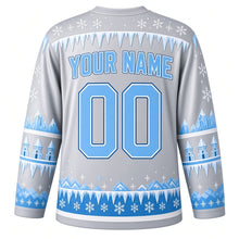 Load image into Gallery viewer, Ugly Christmas Ice Castle Kingdom Hockey Jersey in Icicle Silver, back view with a frosted icicle yoke, turret sleeve bands, a sky blue icicle and snowflake hem band, sky blue YOUR NAME and 00 – your name and number
