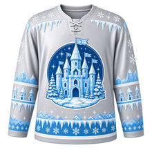 Load image into Gallery viewer, Ugly Christmas Ice Castle Kingdom Hockey Jersey in Icicle Silver, front view – crystal ice castle with turrets and snowflake banners in a blue night-sky medallion, frosted icicle yoke and sky blue ice-crystal bands – custom name and number