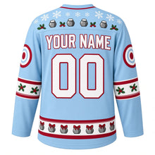 Load image into Gallery viewer, Ugly Christmas Curling Stone Cheer Hockey Jersey in Ice Blue, back view with a festive snowflake yoke, holly and broom sleeve bands, a hem band of curling stones wearing bows, arched YOUR NAME lettering and 00 – custom name and number