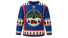 Load image into Gallery viewer, Ugly Christmas Tree Farm Hockey Jersey in Denim Blue, front view – denim blue body with a round decorated-pine, string-light and tree-wagon crest, pine-tree yoke, tree and bow sleeve bands and a tree-row hem band – custom name and number