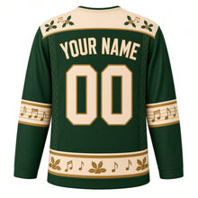 Load image into Gallery viewer, Ugly Christmas Folk Fiddle Hoedown Hockey Jersey in Holly Green, back view with a cream holly and music note yoke on green, cream and gold YOUR NAME and 00, music-staff elbow bands and a holly and notes hem – your name and number