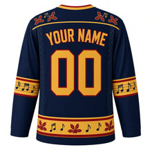Load image into Gallery viewer, Ugly Christmas Folk Fiddle Hoedown Hockey Jersey in Midnight Navy, back view with red holly and music notes on the navy yoke, gold YOUR NAME and 00 trimmed in red, gold music-staff bands and a gold holly hem band – your name and number
