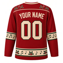 Load image into Gallery viewer, Ugly Christmas Folk Fiddle Hoedown Hockey Jersey in Barn Red, back view with holly and music notes on the yoke, cream YOUR NAME and 00 on barn red, music-staff sleeve bands, diamond side panels and a holly hem band – your name and number
